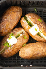 Load image into Gallery viewer, baked potatoes in air fryer basket
